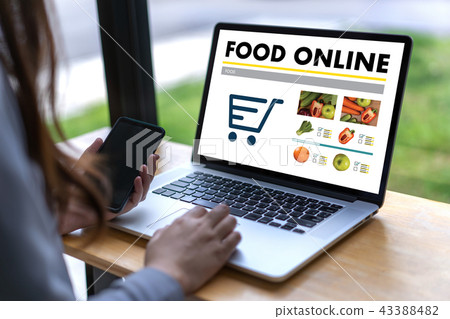 Close up woman ordering food online  by internet  43388482