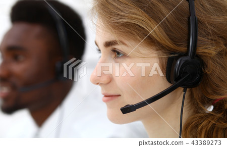 Call center operator.Young beautiful  brunette woman in headset. Business concept 43389273