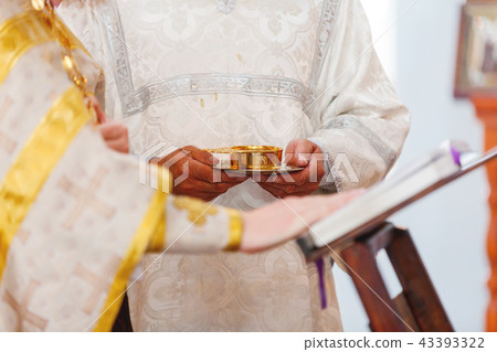 Wedding ceremony in orthodox Church. Priest Wedding ceremony in orthodox Church. Priest 43393322