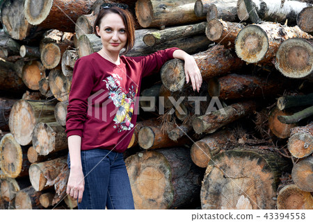 young girl having fun in forest, posing near logs 43394558