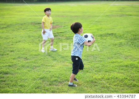 Boys playing soccer 43394787