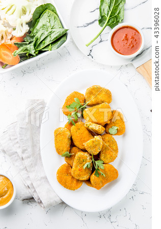 Healthy vegetarian nuggets with carrots, cauliflower and spinach. Vegetable nuggets. Vegan food. Top Healthy vegetarian nuggets with carrots, cauliflower and spinach. Vegetable nuggets. Vegan food. Top 43396028
