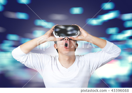 Young asian man in casual white wearing VR glasses 43396088