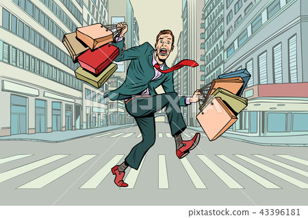 a man with shopping crossing the road 43396181