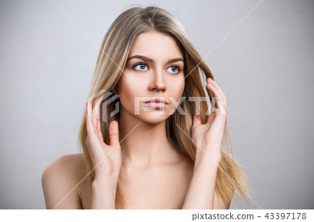 Beautiful young blonde woman with clean skin. Beautiful young blonde woman with clean skin. 43397178