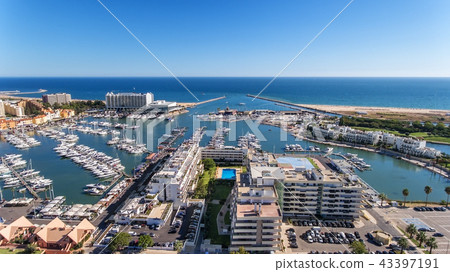 Aerial view of the bay of the marina, with luxury yachts in Vilamoura. Aerial view of the bay of the marina, with luxury yachts in Vilamoura. 43397191