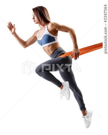 Young sporty woman using a resistance band. 43397564