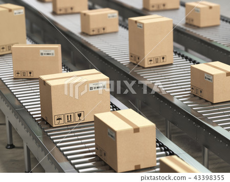 Cardboard boxes on conveyor in warehouse Cardboard boxes on conveyor in warehouse 43398355