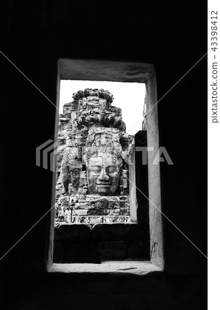 Framed by stone with buddha face in Angkor Wat  43398412