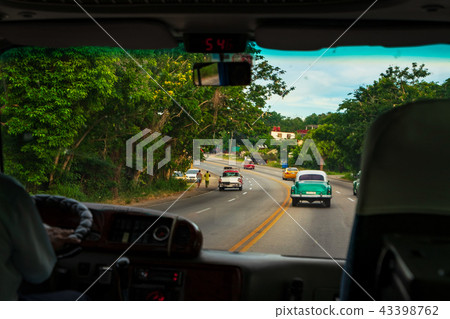 Looking through car window to road Looking through car window to road 43398762
