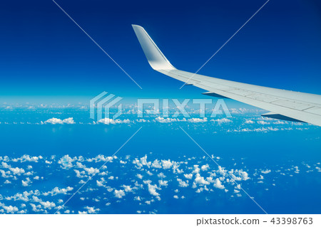 Looking through aircraft window Looking through aircraft window 43398763