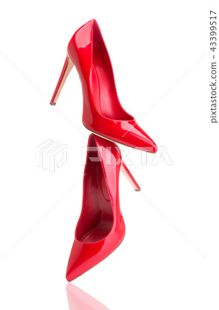 Red high-heeled shoes. Flying red shoes. 43399517