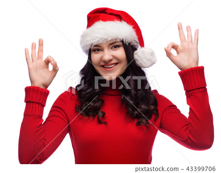 woman wearing santa hat doing ok gesture,isolated woman wearing santa hat doing ok gesture,isolated 43399706