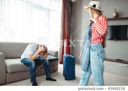 Wife chooses dress on a trip against tired husband Wife chooses dress on a trip against tired husband 43400158