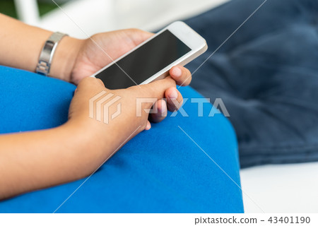 Close up hand holding mobile smart phone with copy Close up hand holding mobile smart phone with copy 43401190