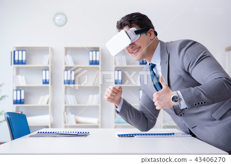 Businessman with virtual reality glasses in the office 43406270
