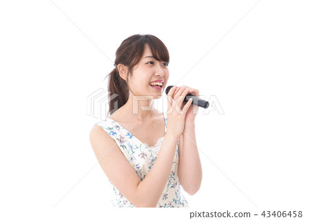 Young woman singing in karaoke 43406458