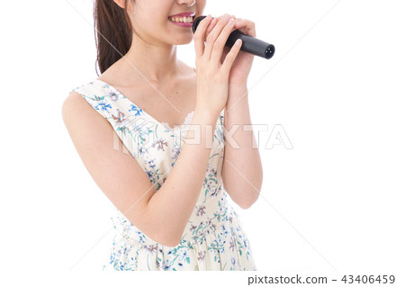Young woman singing in karaoke 43406459