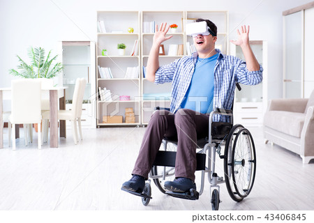 Disabled man studying with virtual reality glasses Disabled man studying with virtual reality glasses 43406845