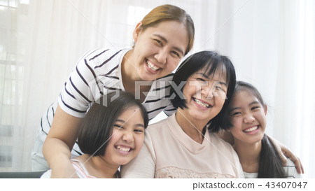 Happy Asian family smiling together at home 43407047