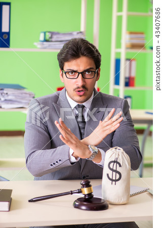 Young handsome lawyer working in the office  43407686