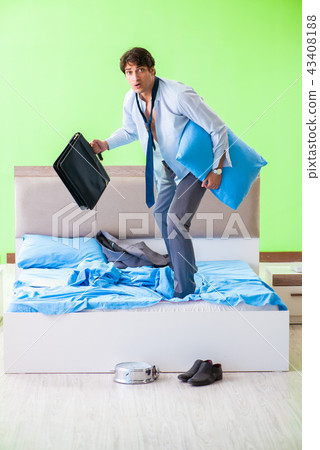 Employee in the bedroom being late for his job  43408188