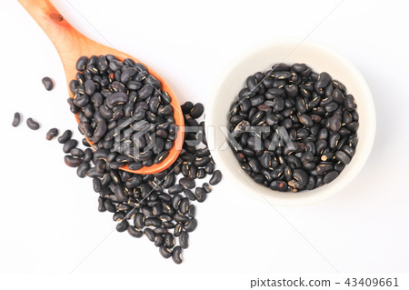 black beans with wooden spoon and in cup on white black beans with wooden spoon and in cup on white 43409661