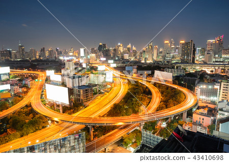 Aerial view traffic glowing on elevated road Aerial view traffic glowing on elevated road 43410698