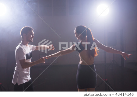 Young couple dancing latin dance Bachata, merengue, salsa. Two elegance pose in dance class 43414146