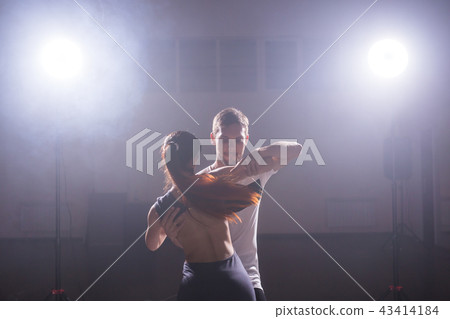 Active happy adults dancing bachata together in dance class 43414184