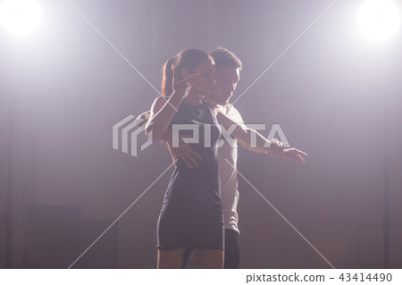 Active happy adults dancing bachata together in dance class Active happy adults dancing bachata together in dance class 43414490