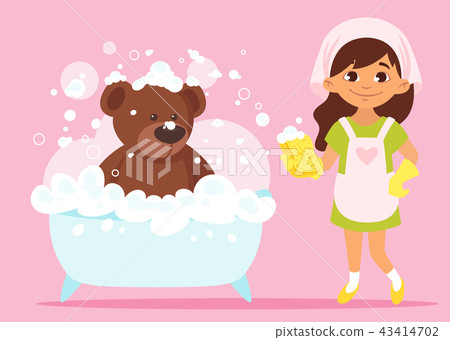 girl cleaning her bear toy girl cleaning her bear toy 43414702