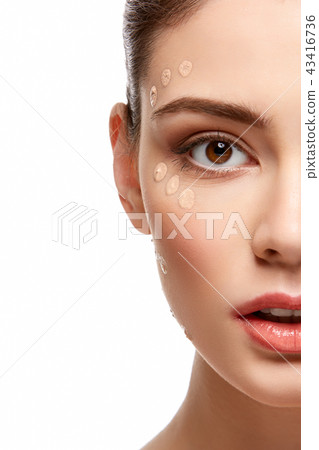 girl applying foundation on face isolated on white girl applying foundation on face isolated on white 43416736