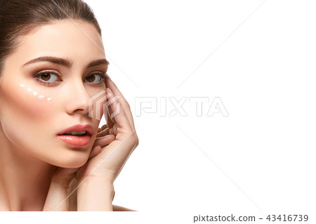 girl applying moisturizing cream isolated on white 43416739