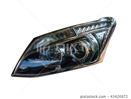 Closeup of car headlight isolated on white 43420872