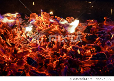 Burning firewood in the fireplace close up, BBQ fire, charcoal background. 43425099