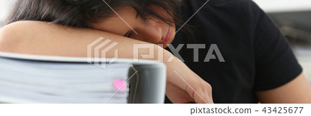 Tired and exhausted woman have a lot of work with documents fall asleep Tired and exhausted woman have a lot of work with documents fall asleep 43425677