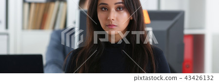 young beautiful brunette woman sit at table in office in cabinet of her boss young beautiful brunette woman sit at table in office in cabinet of her boss 43426132