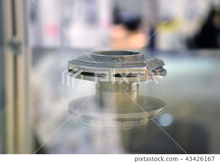 Selective Laser Melting. Object printed on metal 3d printer close-up. Selective Laser Melting. Object printed on metal 3d printer close-up. 43426167