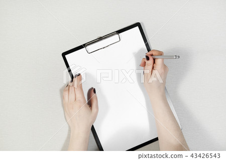 Paper in female hands Paper in female hands 43426543