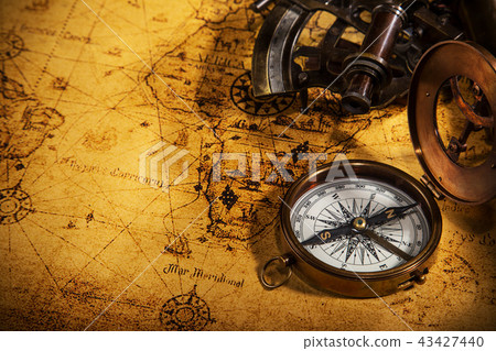 Old vintage navigation equipment on old world map. Old vintage navigation equipment on old world map. 43427440