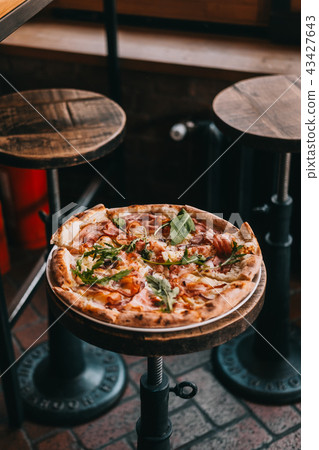 Pizza carbonara on rustic wooden table Pizza carbonara on rustic wooden table 43427643