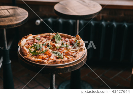 Pizza carbonara on rustic wooden table Pizza carbonara on rustic wooden table 43427644