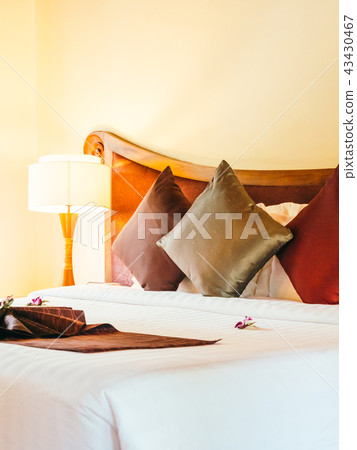 Comfortable pillow on bed decoration in hotel bedroom Comfortable pillow on bed decoration in hotel bedroom 43430467