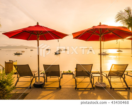 Umbrella and chair around outdoor swimming pool in hotel and resort Umbrella and chair around outdoor swimming pool in hotel and resort 43430468
