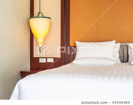 Comfortable pillow on bed decoration in hotel bedroom Comfortable pillow on bed decoration in hotel bedroom 43430469