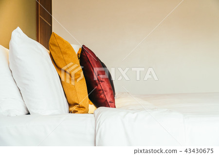 Comfortable pillow on bed Comfortable pillow on bed 43430675