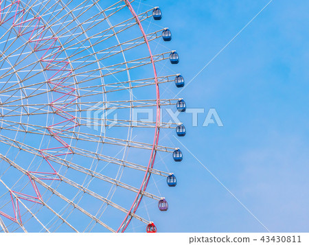 Ferris wheel in the park with blue sky background 43430811