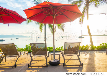 Beautiful tropical sea ocean and beach with umbrella and chair 43431156