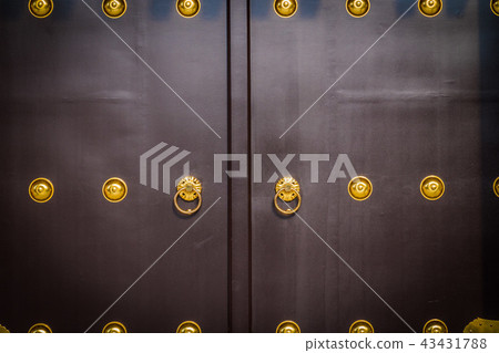 Old and vintage door knob on the gate of temple 43431788